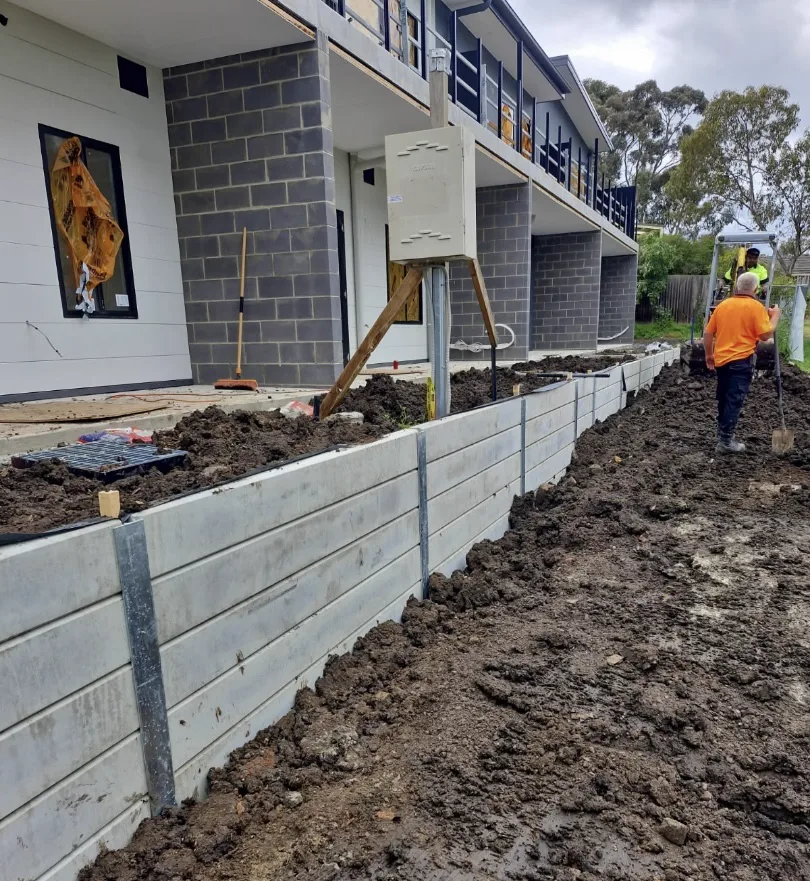 Align Excavation Group crew on site building a concrete sleeper retaining wall